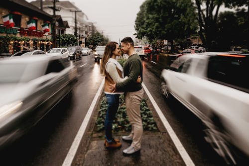 Man And Woman Standing And Facing Each In The Middle Of The Road