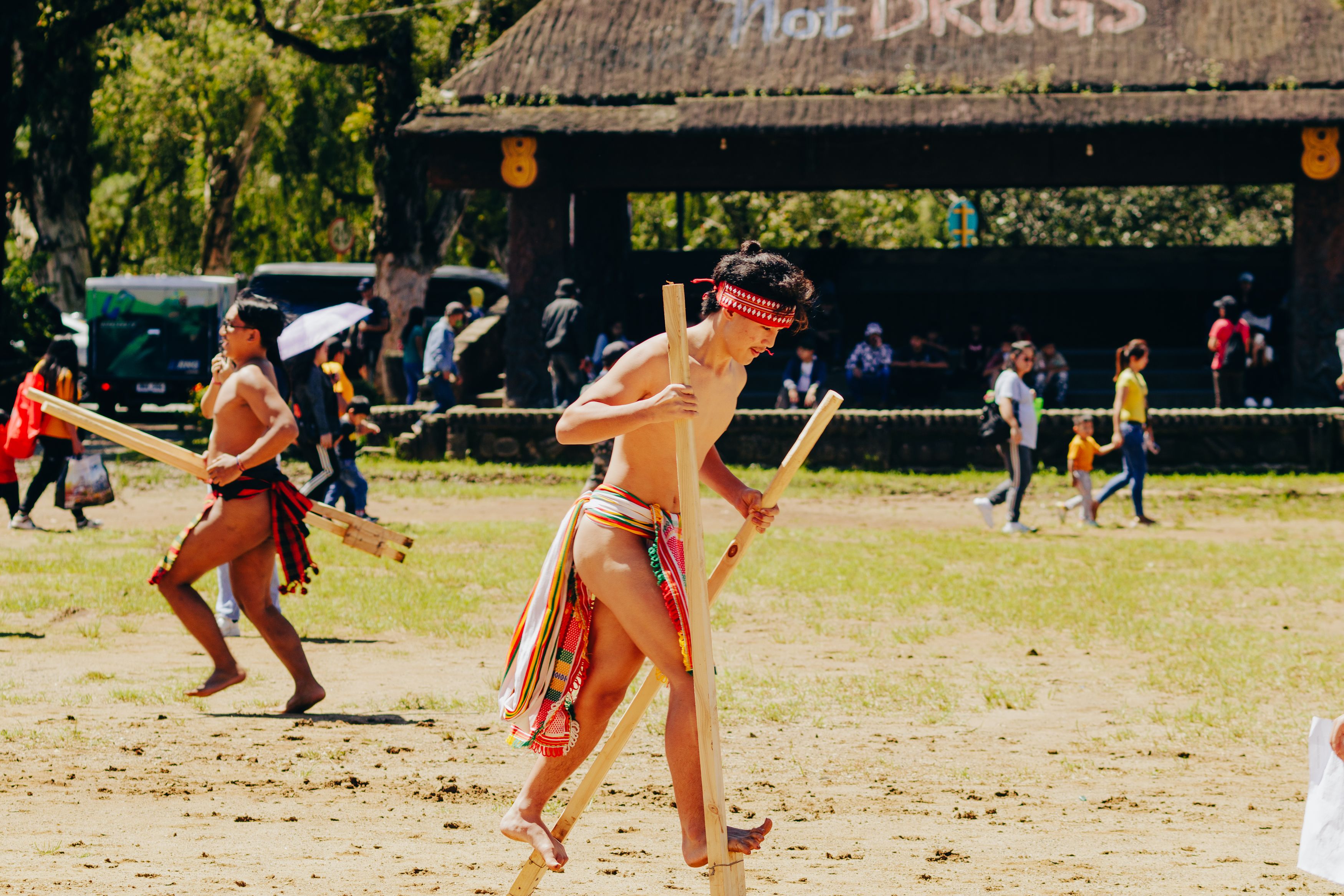 Traditional Cultural Event with Stilts Performance · Free Stock Photo