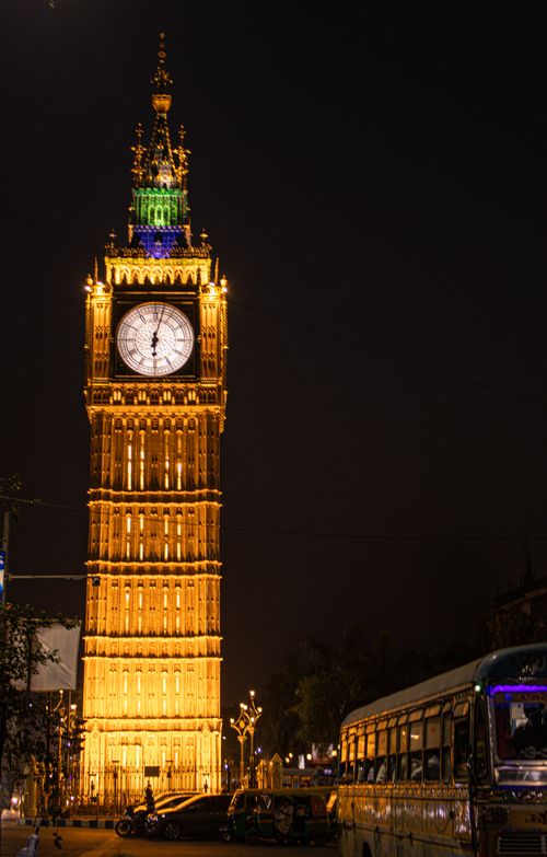 Free Iconic Big Ben tower illuminated against a night sky in London, England. Stock Photo