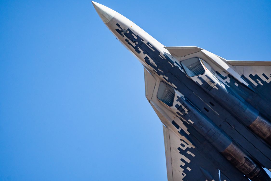 Dynamic Jet Fighter in Flight Against Clear Sky · Free Stock Photo