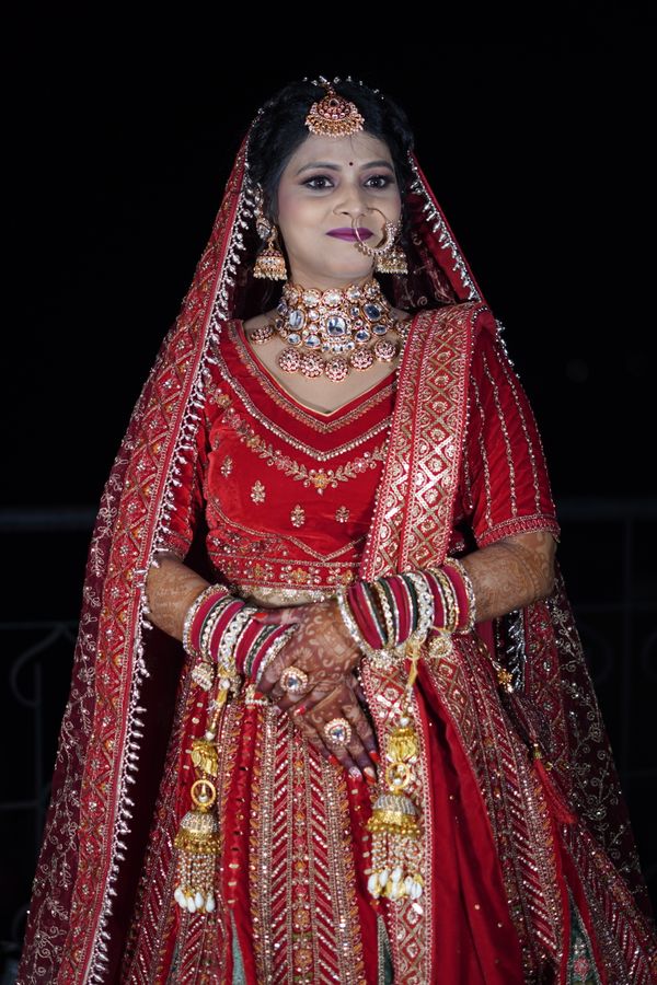 Indian bride in a red lehenga with traditional jewellery