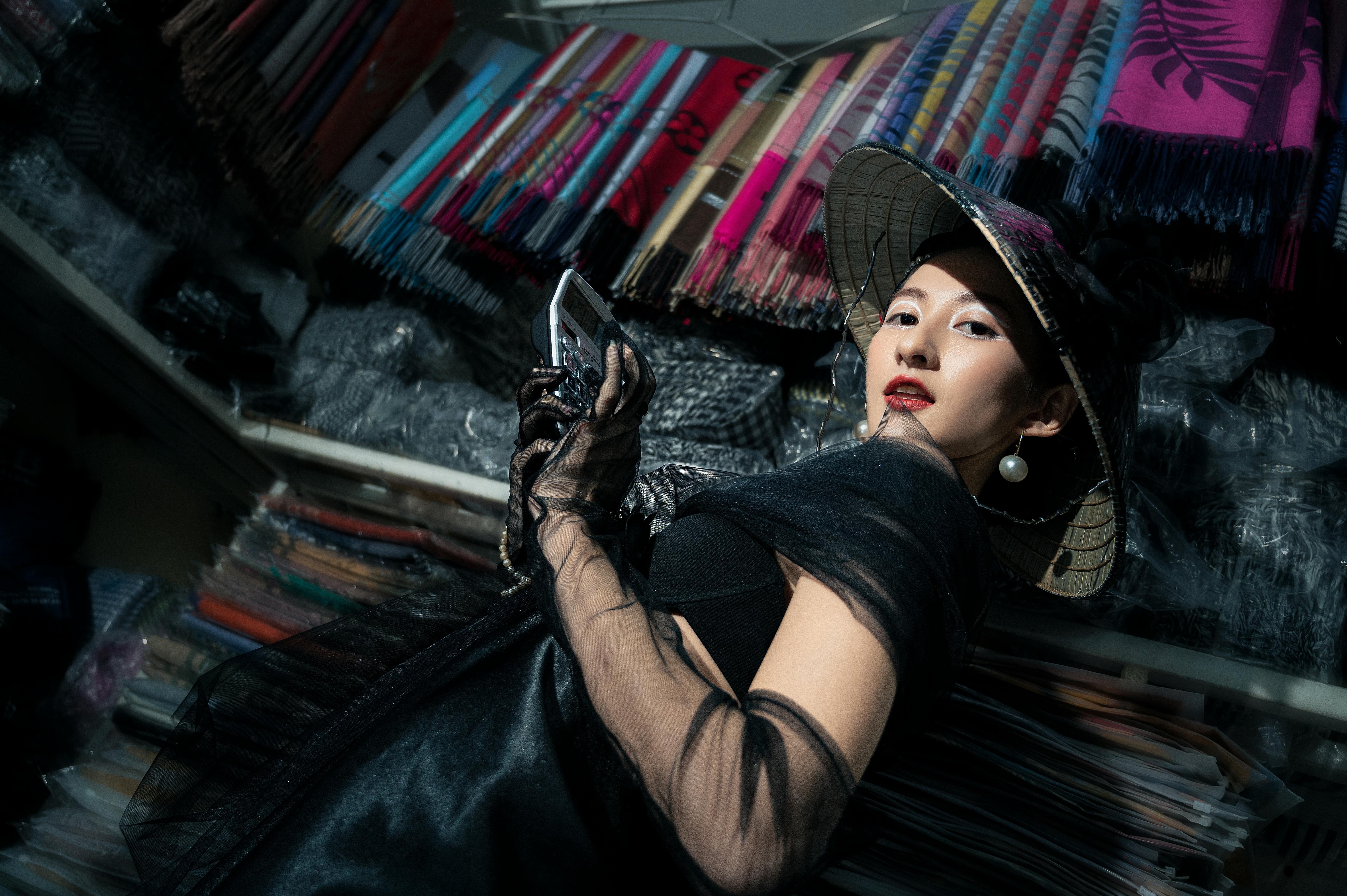 Stylish Portrait of Woman with Camera Indoors