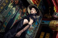 Elegant Woman in Traditional Temple Setting