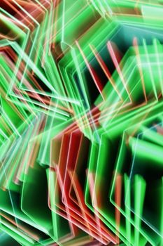 Vibrant abstract image of neon light patterns in green and red hues, creating dynamic movement.
