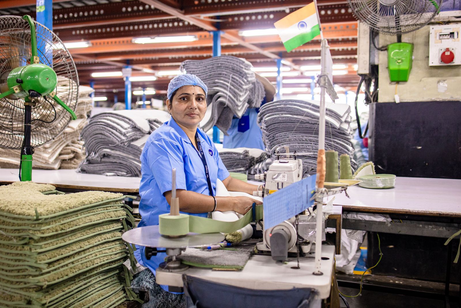 Textile worker sewing fabric
