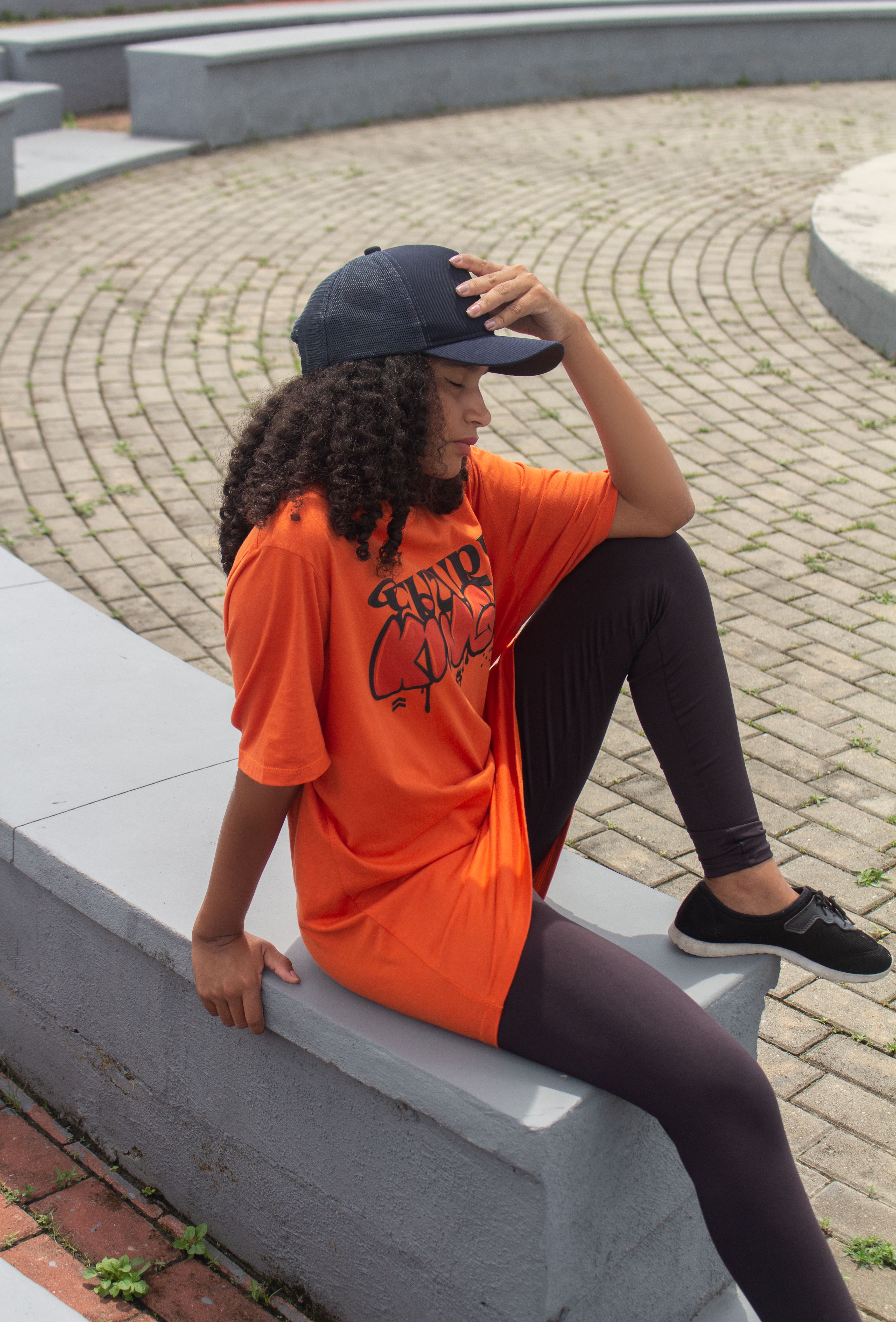 Young Woman Relaxing in Urban Park Setting · Free Stock Photo