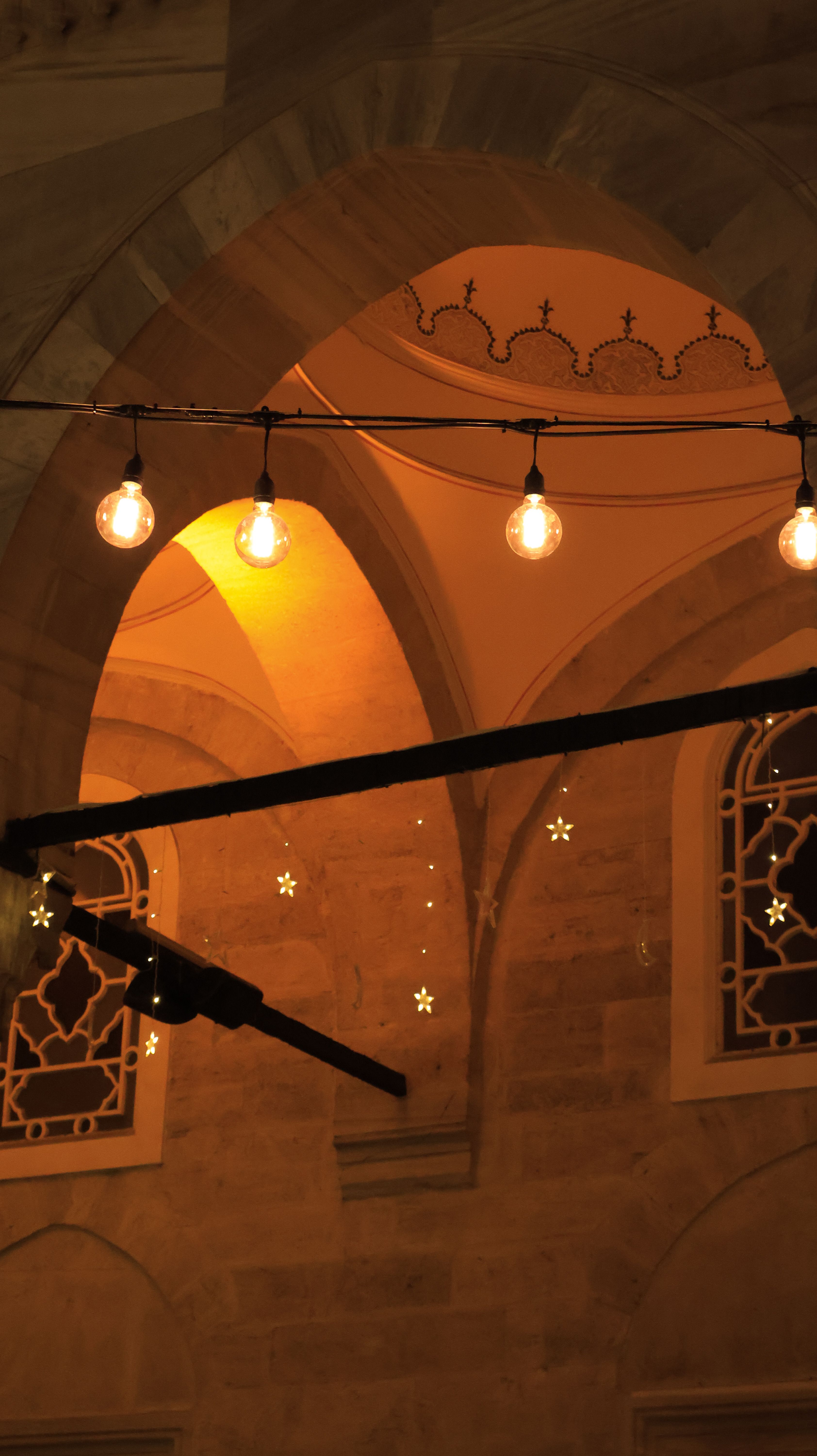 Warmly Lit Arches With String Lights · Free Stock Photo