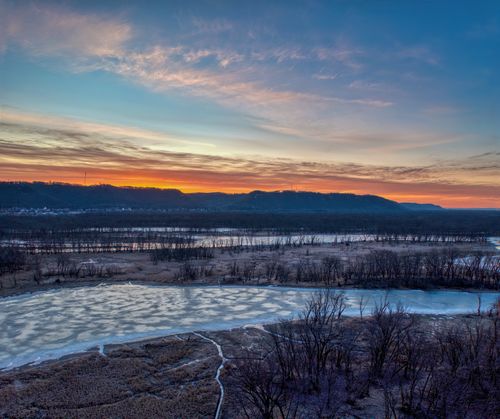 Free A stunning winter sunset over a frozen river in Wabasha, Minnesota, USA. Stock Photo