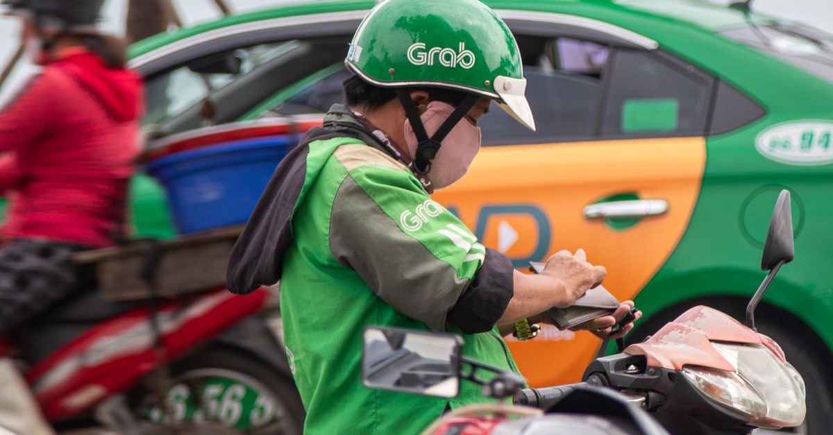 Grab Rider Background Grab Motorcycle Driver in Da Nang, Vietnam · Free Stock Photo
