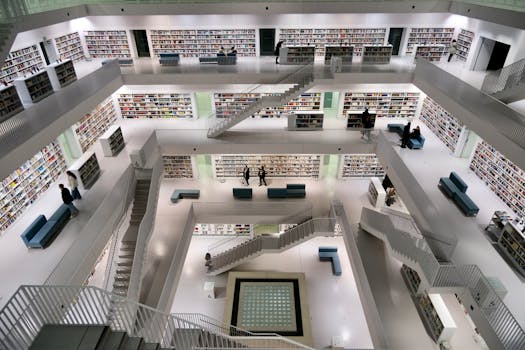 A spacious, contemporary library with minimalist architecture and bookshelves on multiple levels.