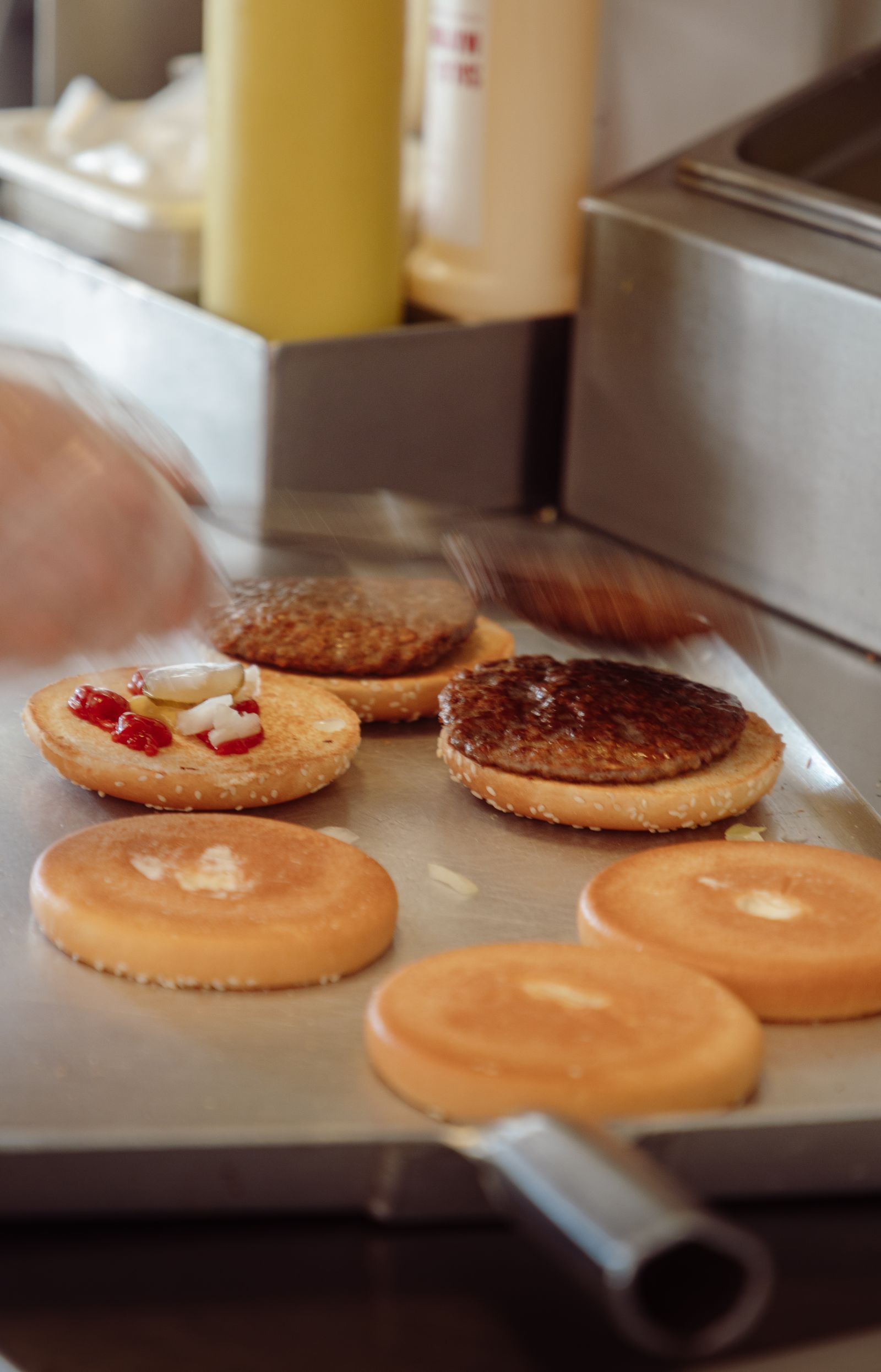 Burger patties on a production line