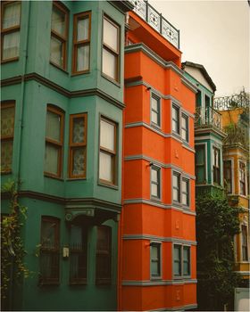 Vibrant urban building facades in a rich color palette, ideal for cityscape themes.