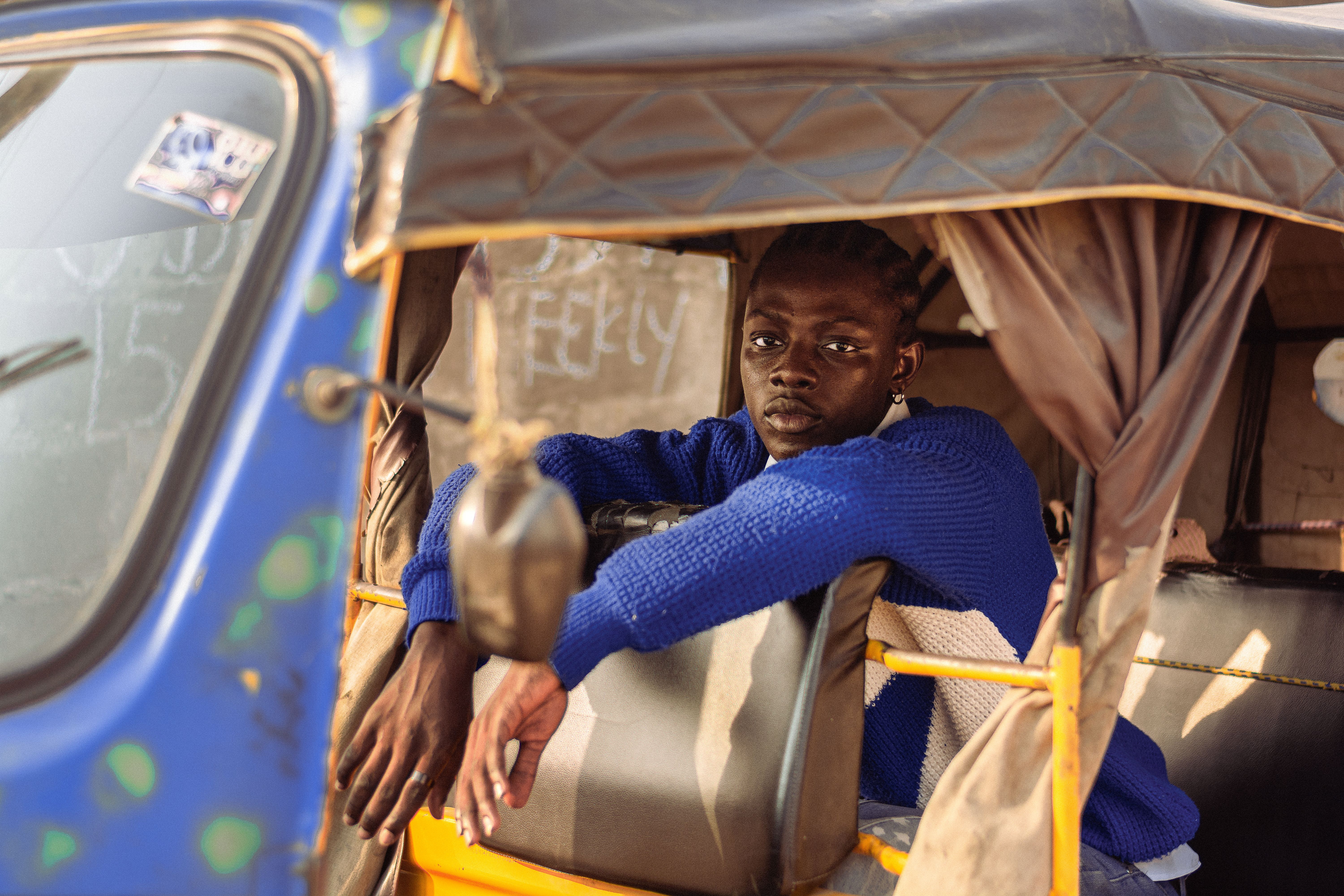 Youthful Expression Inside A Lagos Keke Free Stock Photo