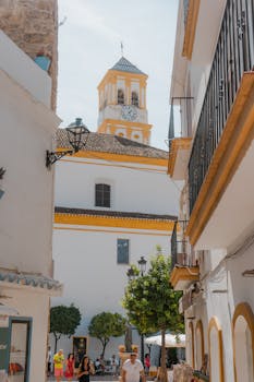 Picturesque street view in Marbella, showcasing traditional Andalusian architecture.