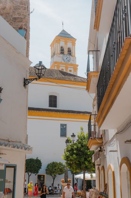 Picturesque street view in Marbella, showcasing traditional Andalusian architecture.