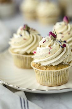 Delicious cupcakes with floral frosting, perfect for special occasions.