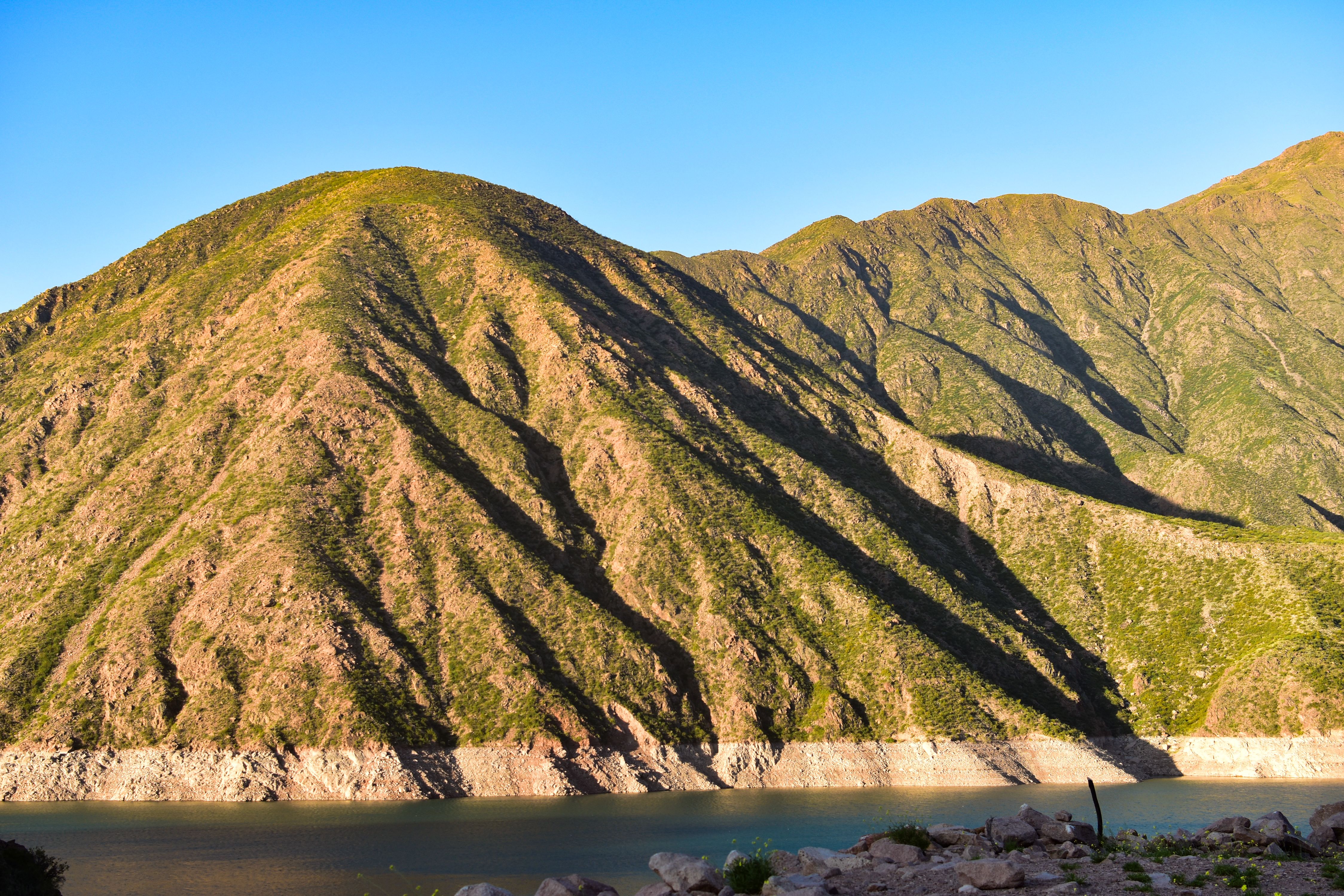 Stunning view of Mendoza's rugged mountains with clear blue skies.
