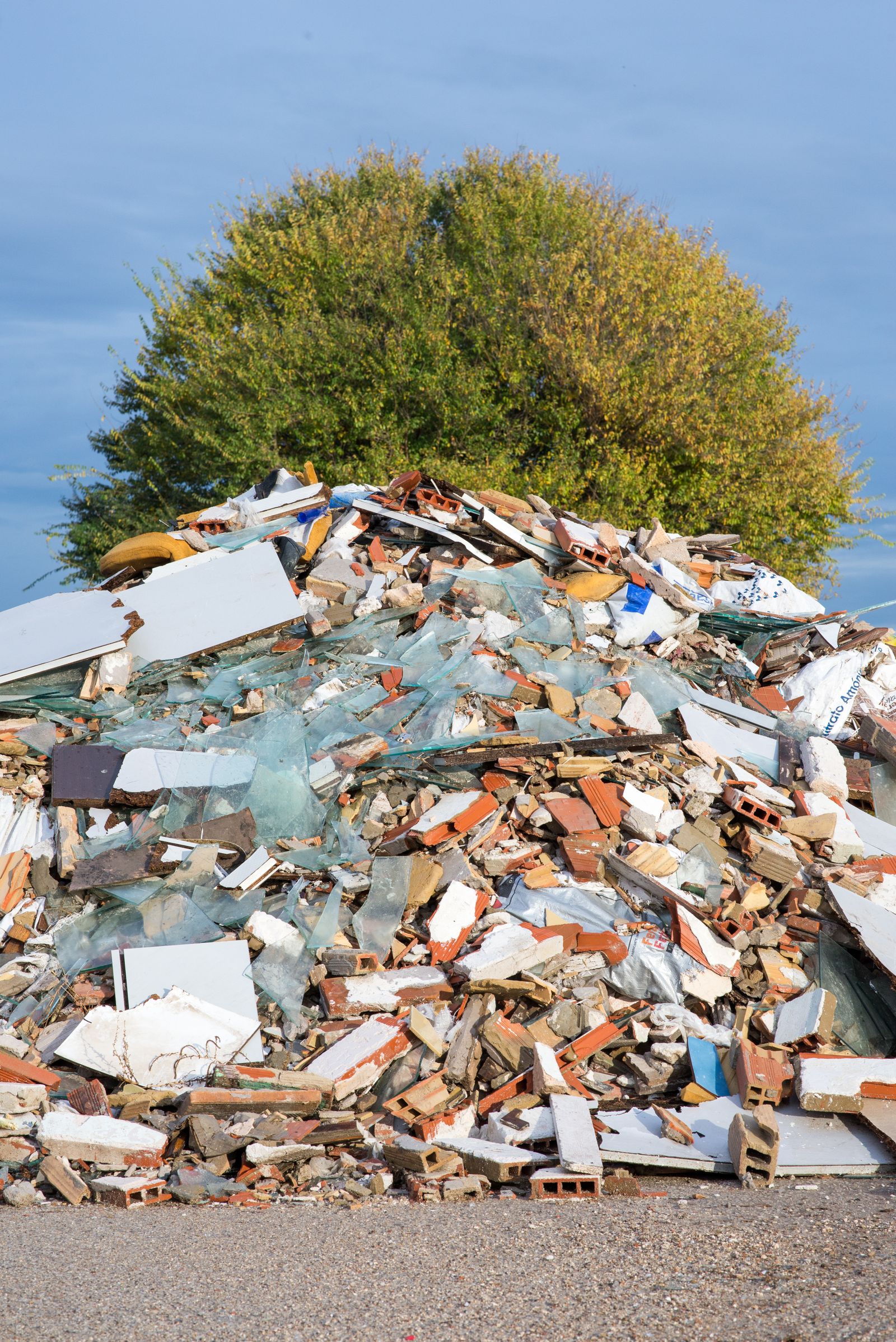 Worker clearing construction debris during site cleanup