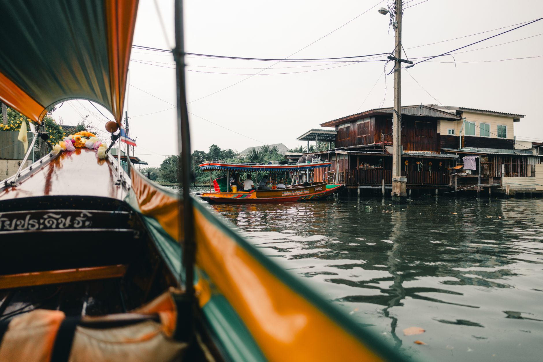 Wooden shophouses and canal near Phra Sumen Fort in Banglamphu