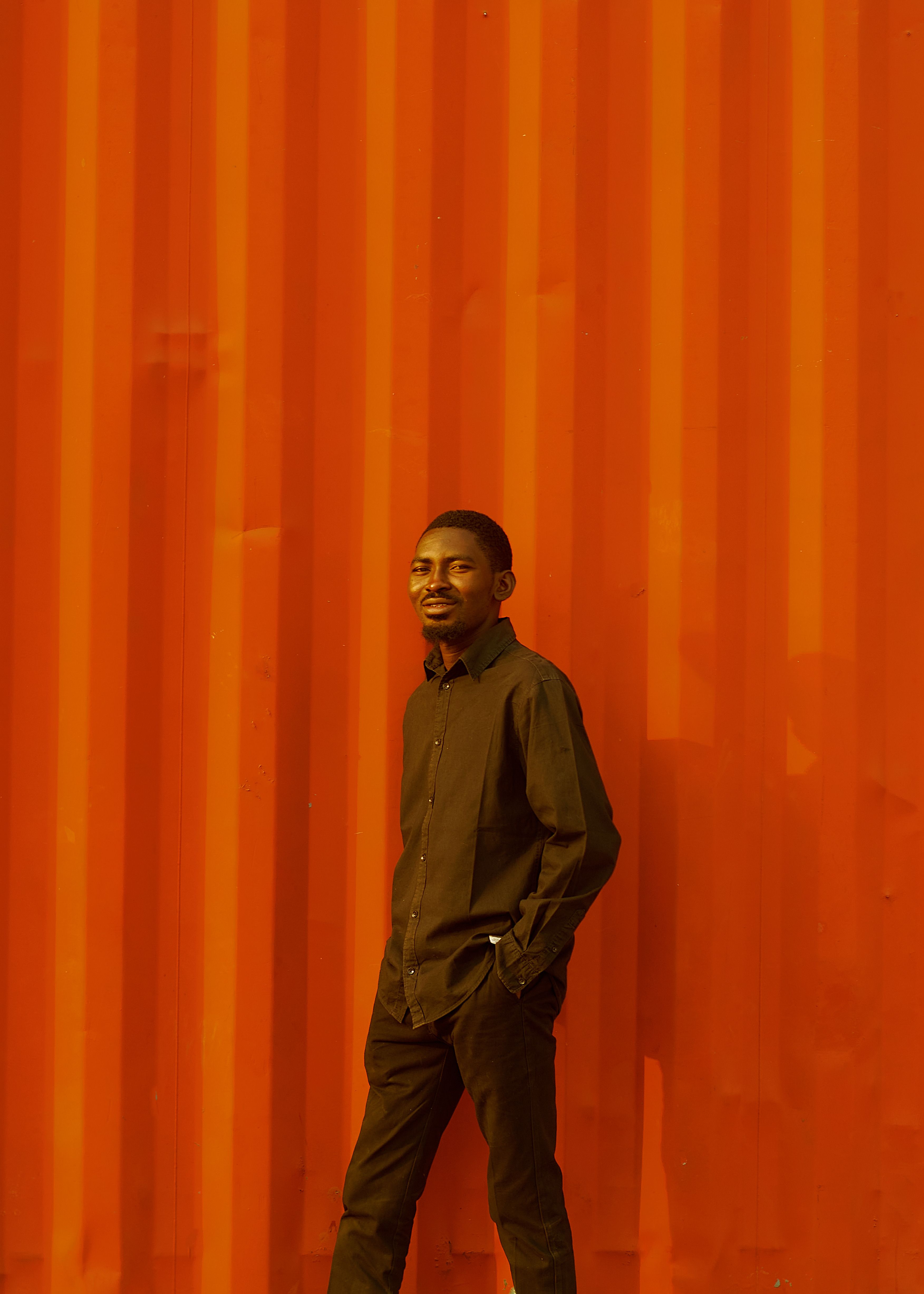 Stylish Portrait Against Vibrant Red Background · Free Stock Photo