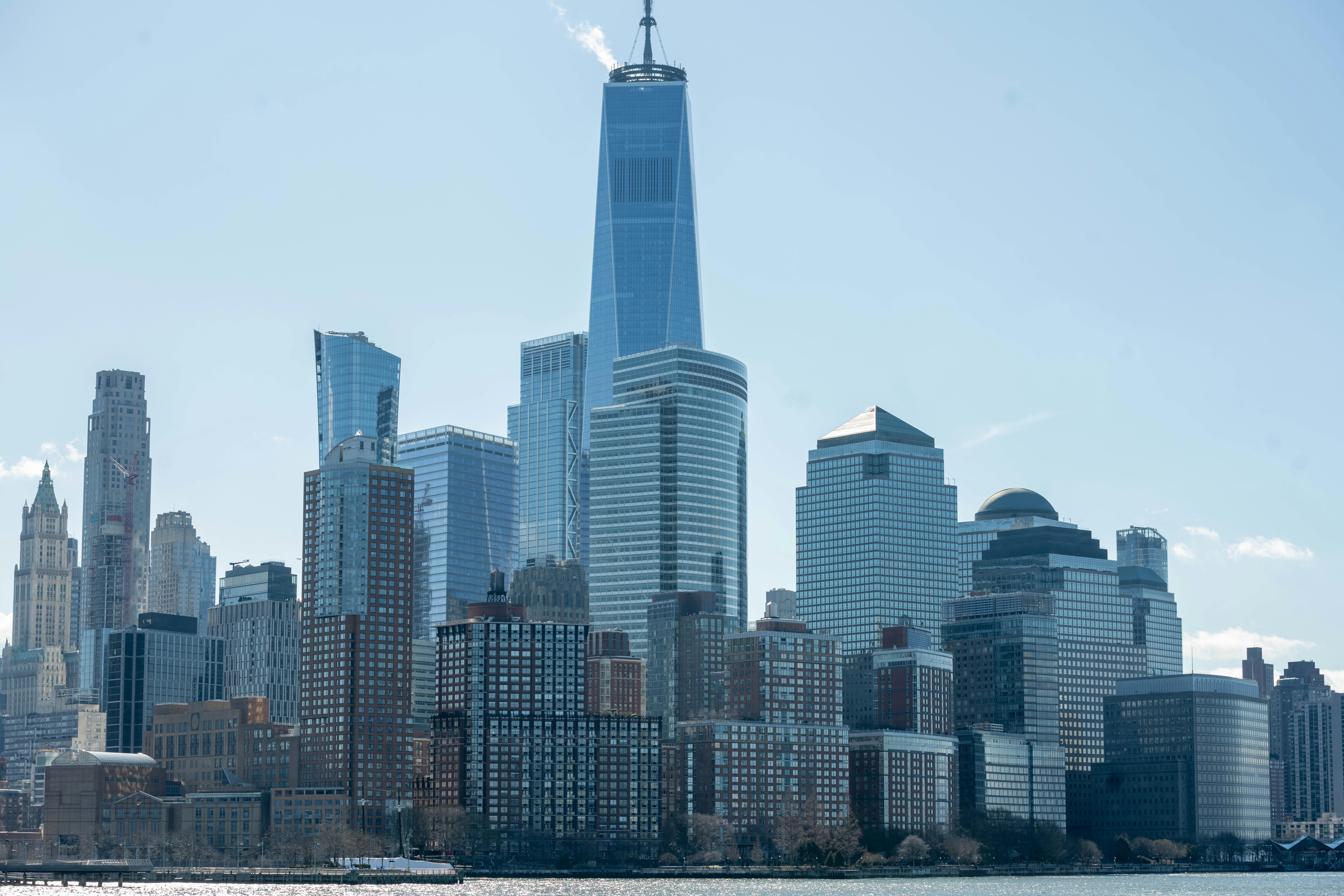 Stunning daytime view of New York City skyline featuring One World Trade Center.