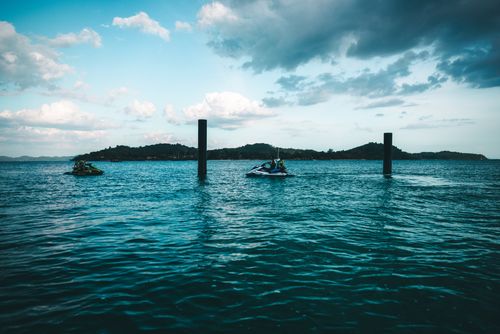 Free Scenic jet ski adventure across the vibrant seas of Phuket, Thailand. Stock Photo