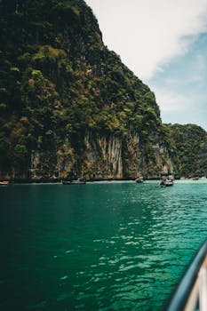 Explore the stunning limestone cliffs and turquoise waters of Phuket, Thailand.