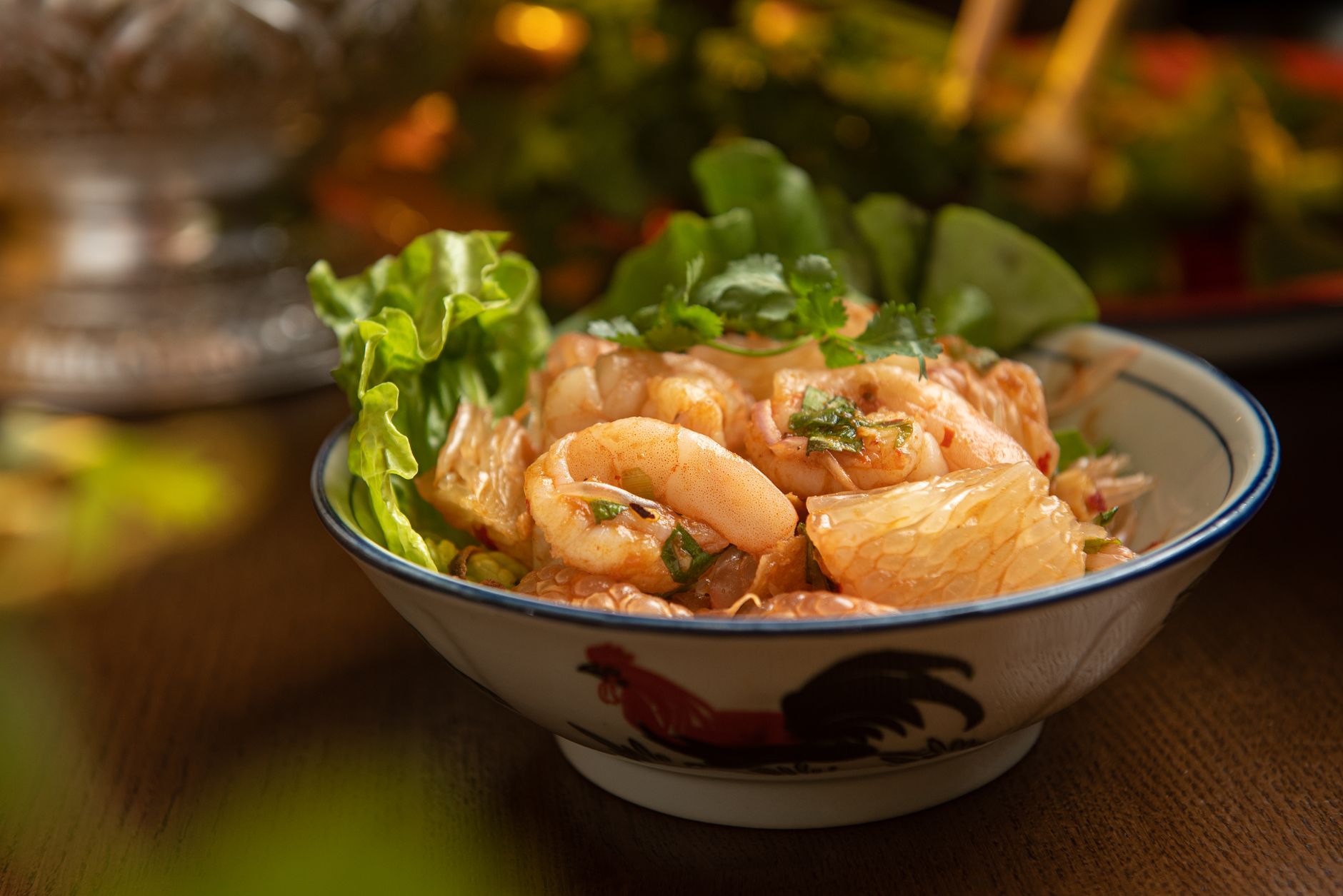 Plate of River Prawn Pad Thai garnished with lime