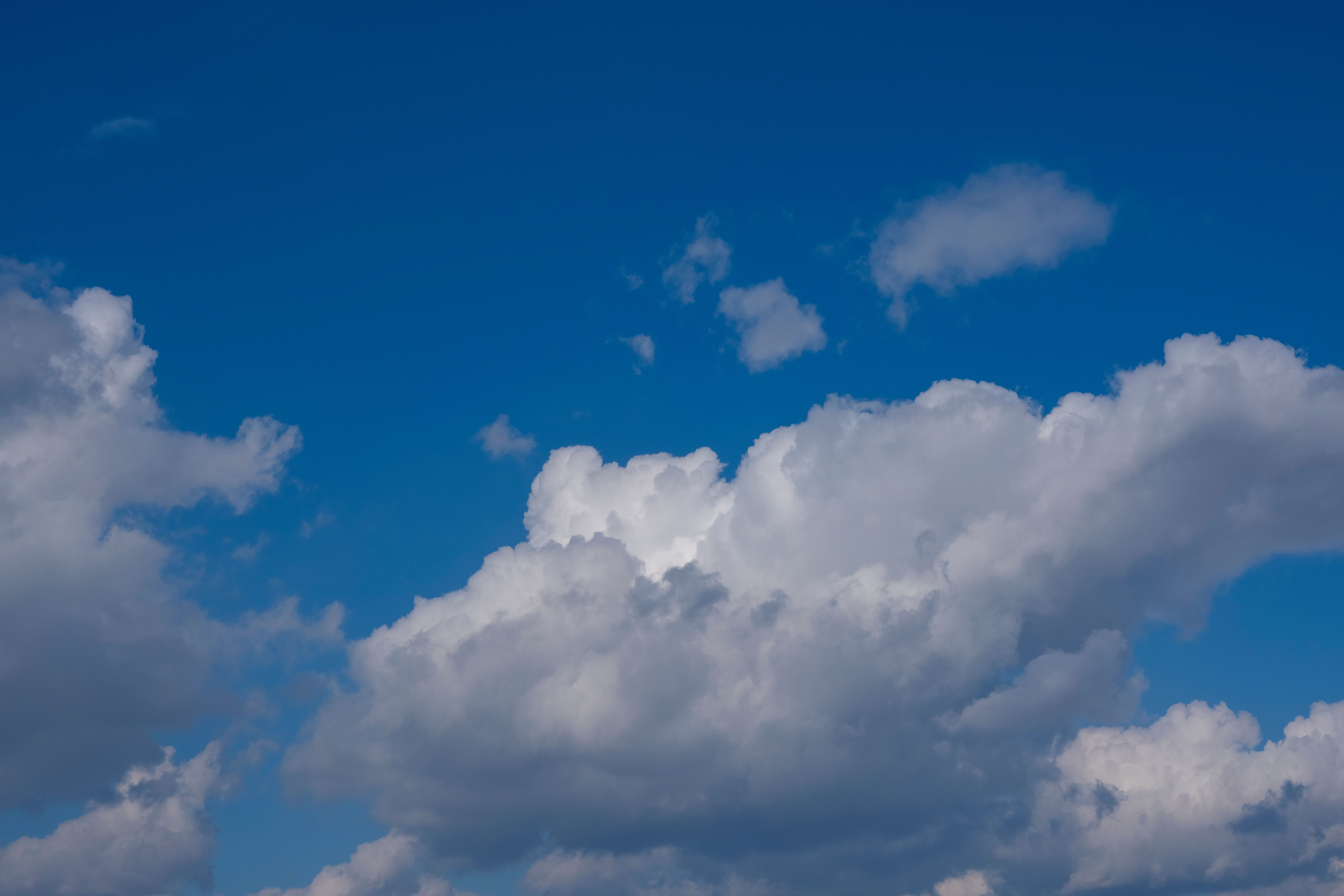 Serene Blue Sky with Fluffy White Clouds · Free Stock Photo