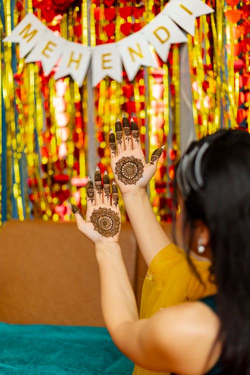 Free Captivating henna design on hands during a colorful Nepali wedding celebration. Stock Photo