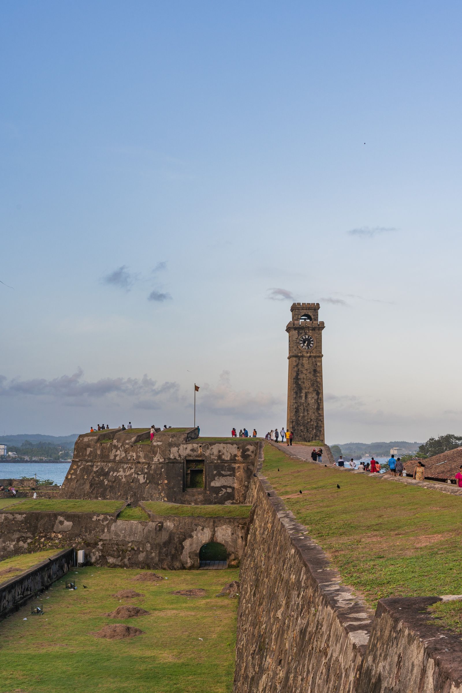 Galle Fort clock tower and stone ramparts under an evening sky