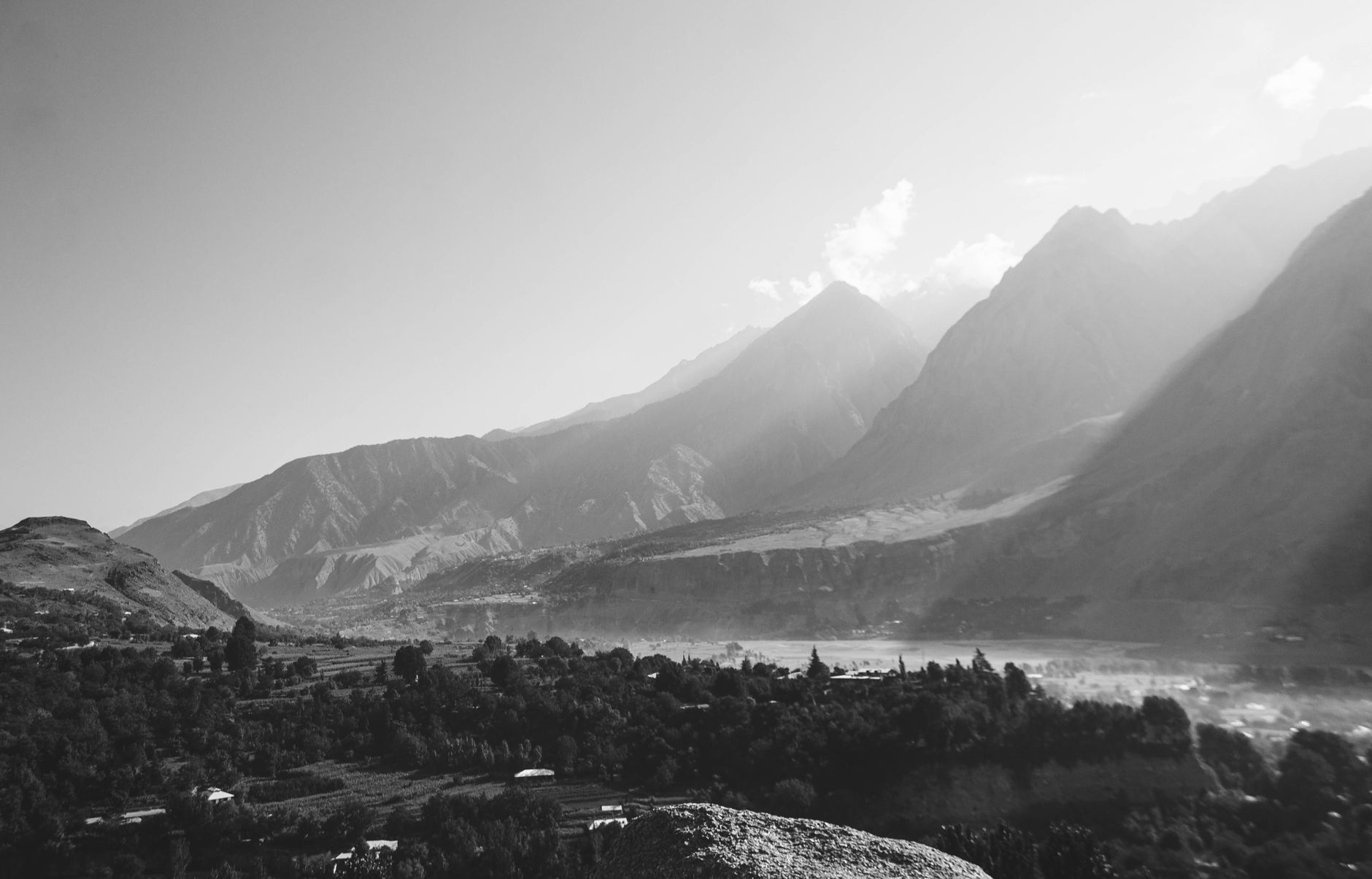 Captivating black and white view of Chitral Valley's scenic mountain landscape.