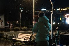 A green puffer jacket in a snowy park, standing in for the Northvane Summit Heated Jacket