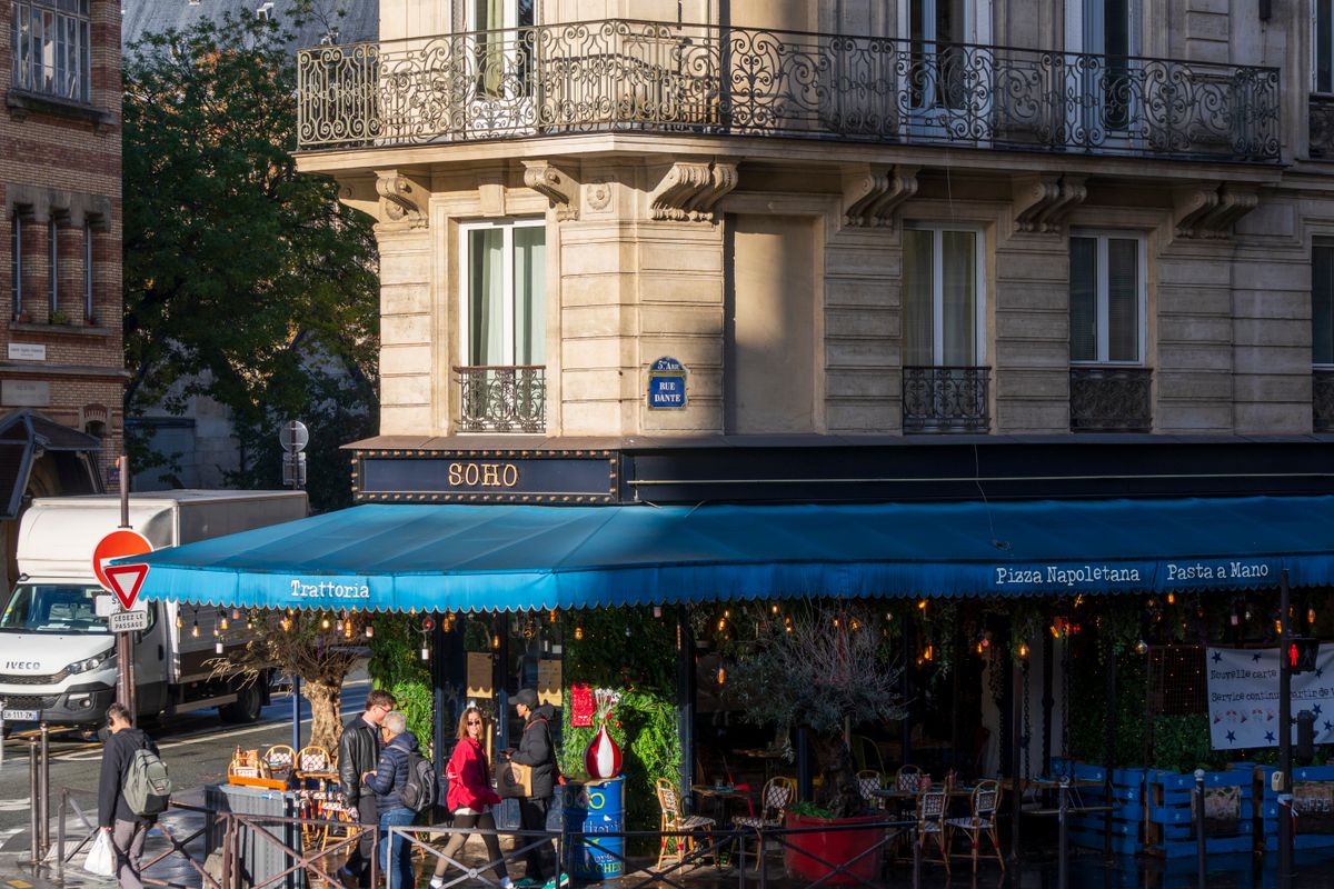 A Parisian café terrace — the essential setting for the city's slow, unhurried rhythm.