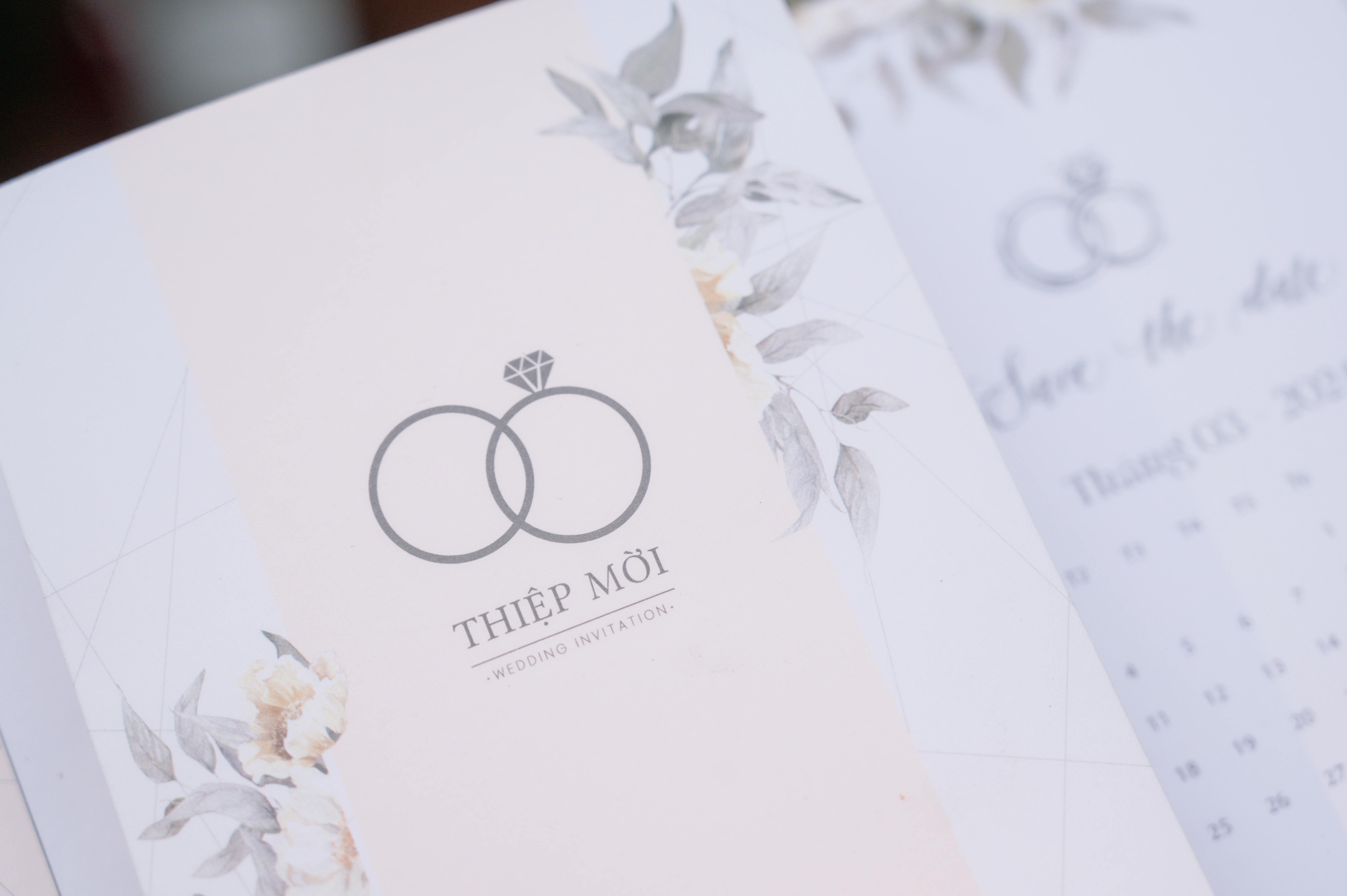 A beautifully designed floral wedding invitation with subtle pastel colors and elegant typography.