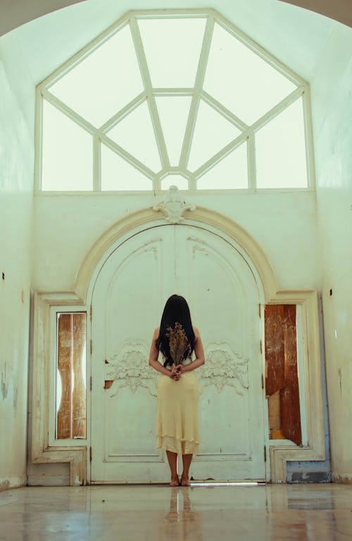 Woman Standing In Front Of A Door Wearing A Veil