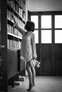 Monochrome Photo Of Woman Reaching For Book