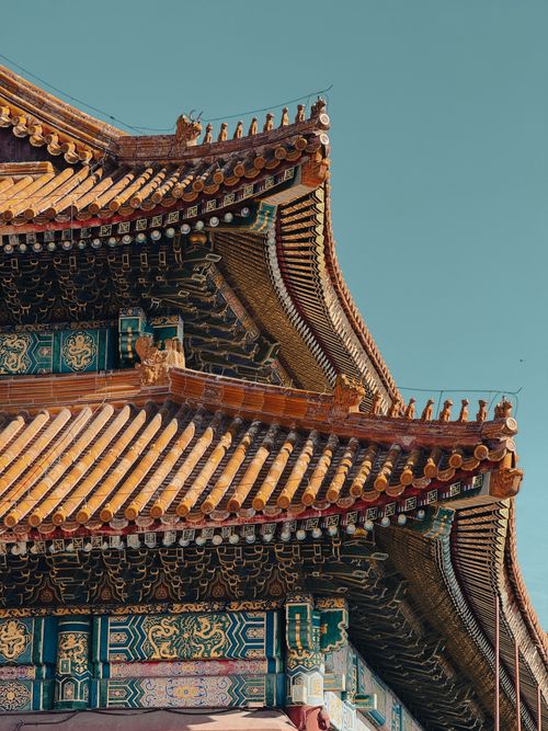 Free Detail of traditional Chinese architecture at the Forbidden City in Beijing with ornate designs and golden roof. Stock Photo