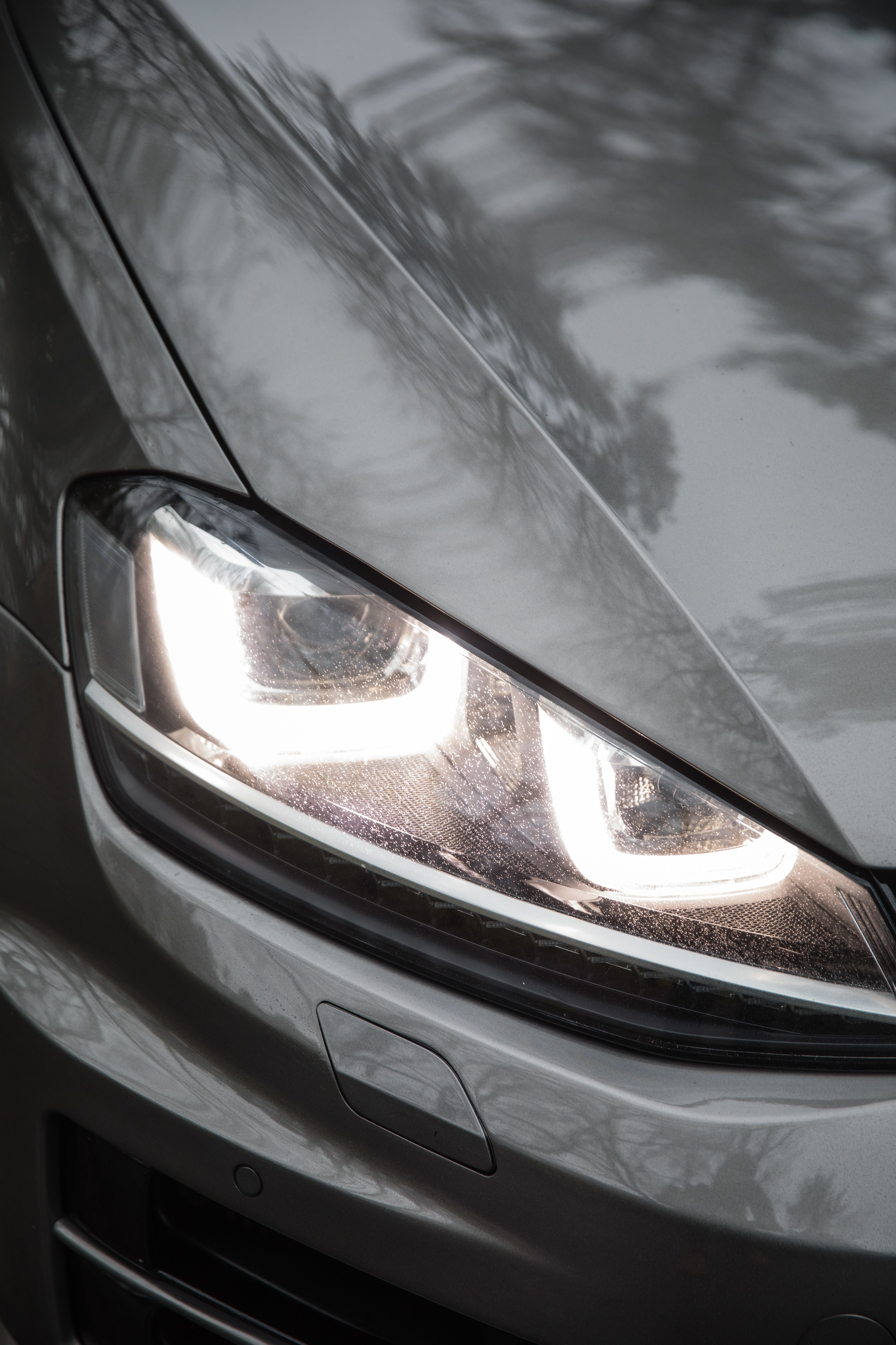 Close-up of Car Headlight at Daytime · Free Stock Photo
