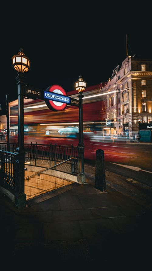 Free Dynamic night photo of London Underground with motion blur, lights aglow. Stock Photo