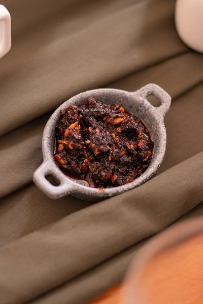 Red chili paste in a rustic bowl — photo by Rodrigo Ortega on Pexels