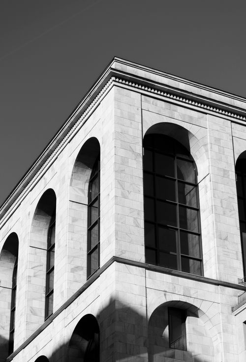 Free Black and white photo of classical architecture in Milan, showcasing elegant arches. Stock Photo