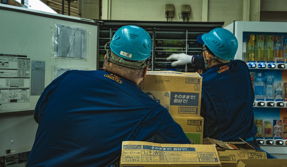 Warehouse team handling shipping boxes