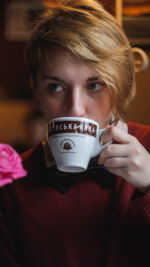 Free Woman Wearing Red Top Holding Teacup Stock Photo