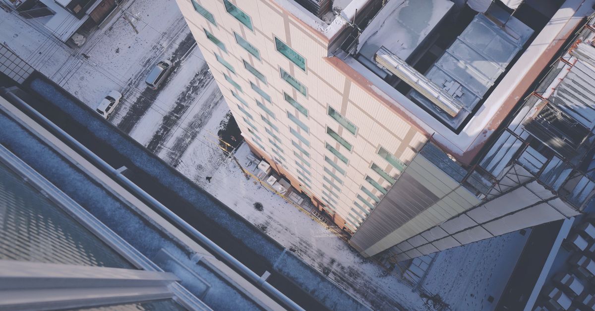 Aerial View of Urban Snow-Covered Building · Free Stock Photo