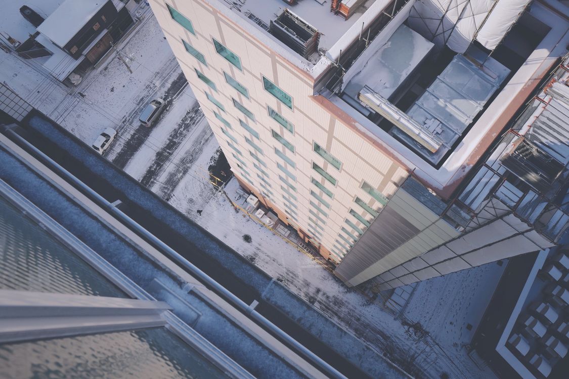 Aerial View of Urban Snow-Covered Building · Free Stock Photo