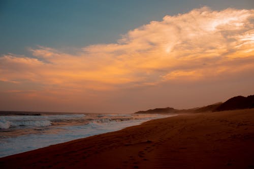 Foto profissional grátis de água, areia, céu rosa