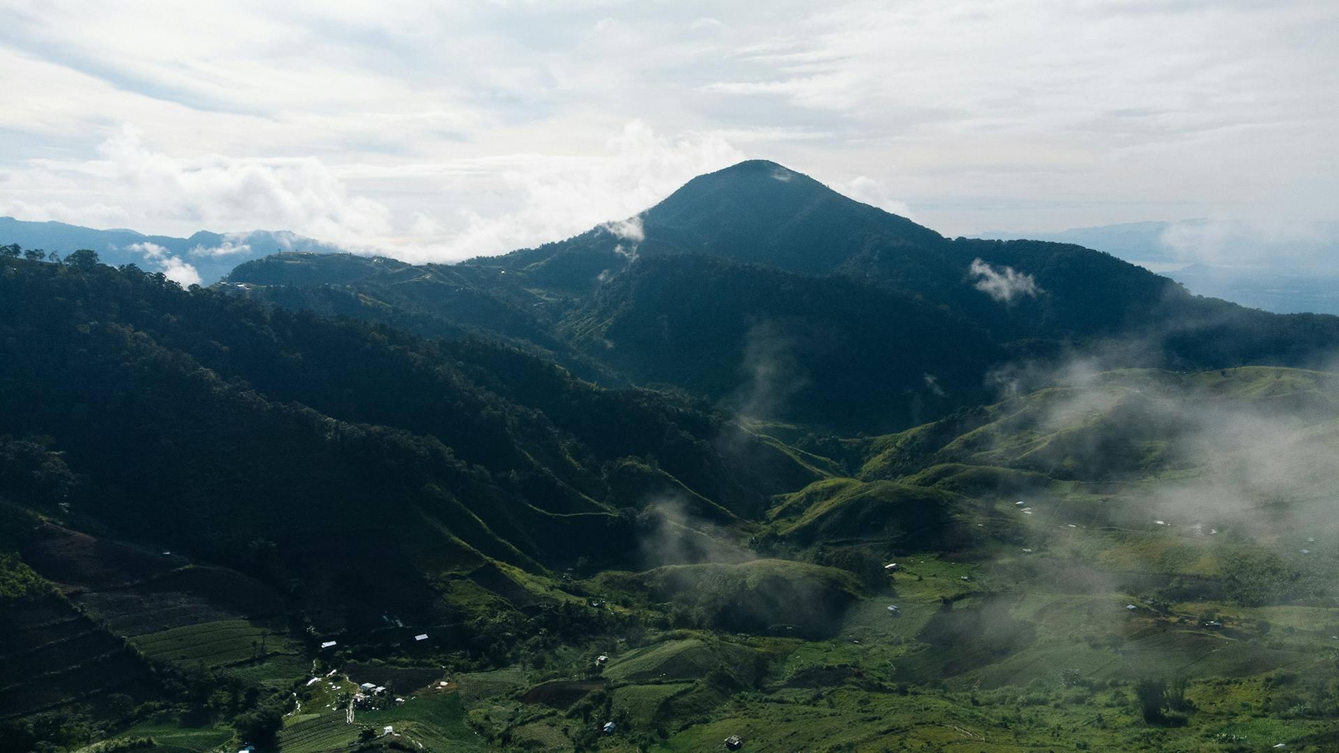 Aerial view of the lush green landscape surrounding Mount Apo, Davao City, Philippines.