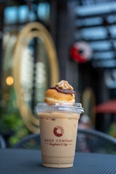 Iced latte topped with donut at Good Company Cafe in Arlington.