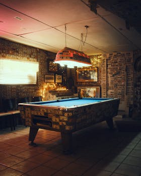 Cozy interior with a pool table and decorative lighting in Bombay Beach, California.